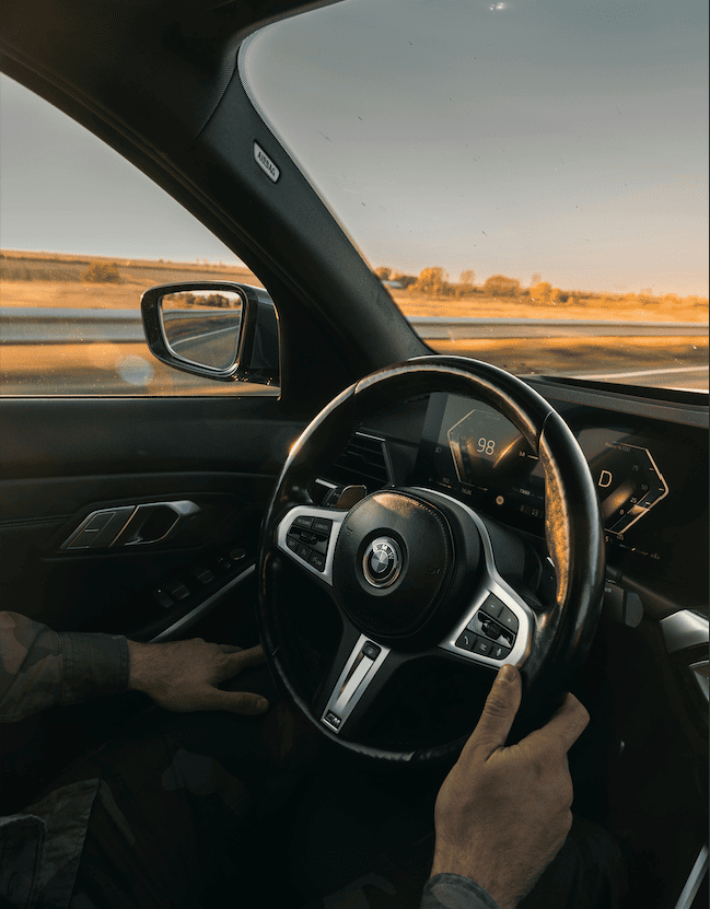 Modern dashboard and road overview during sunset